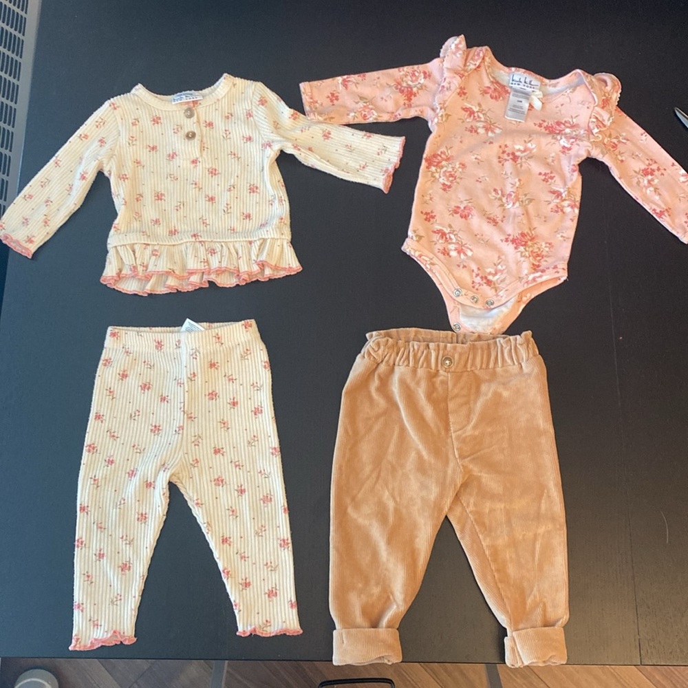 Four piece set of baby clothes